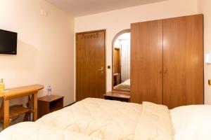 Postel nebo postele na pokoji v ubytování Hotel Kanet