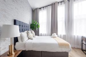 Posteľ alebo postele v izbe v ubytovaní Modern Studio Apartments