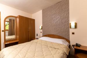 Postel nebo postele na pokoji v ubytování Hotel Kanet