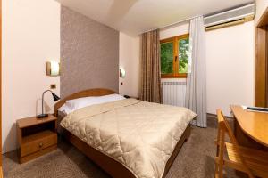 Postel nebo postele na pokoji v ubytování Hotel Kanet