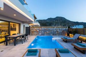 a swimming pool in the middle of a house at Villa Daphne-Naiades/ 2 bedrooms,luxury,beachfront in Plakias