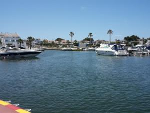 a group of boats docked in a harbor at Cala´n Bosch in Cala en Bosc