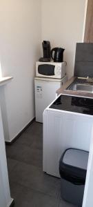 a kitchen with a stove and a sink at My Sweet Home City in Düsseldorf
