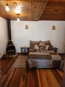 Een bed of bedden in een kamer bij Ksa de Varanda em Visconde de Mauá