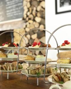 a bunch of trays of food on a table at The Lordleaze Hotel And Restaurant in Chard +80 photos