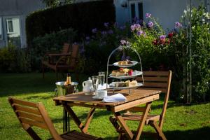 a picnic table with a tray of food on it at The Lordleaze Hotel And Restaurant in Chard