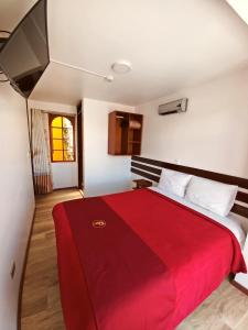 Кровать или кровати в номере Pukara Puka Kantuta