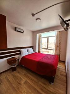 Postel nebo postele na pokoji v ubytování Pukantu Hostal