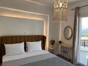 Postel nebo postele na pokoji v ubytování Filia suite-apartment agia anna naxos