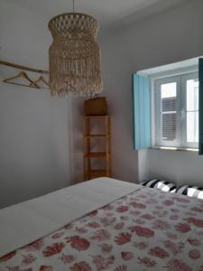 Carlo's Beach Guest House tesisinde bir odada yatak veya yataklar