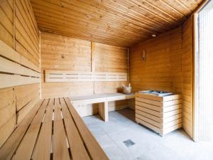 a sauna with a bench in a wooden room at Camping Paradis 4 étoiles A La Corniche La Rochelle Angoulins in Angoulins-sur-Mer
