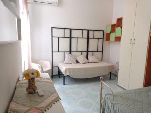 En eller flere senge i et værelse på Appartamento Iasolino