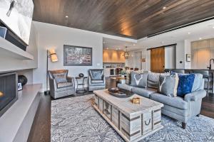 a living room with a couch and a table at One Empire #303 in Park City
