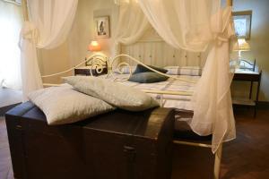 Postel nebo postele na pokoji v ubytování Agriturismo Poggio ai Legni