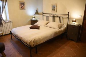 Postel nebo postele na pokoji v ubytování Agriturismo Poggio ai Legni