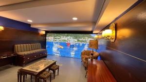 a living room with a couch and a table at Hotel Boutique Arha Villa de Santona in Santoña
