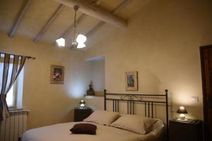 Postel nebo postele na pokoji v ubytování Agriturismo Poggio ai Legni