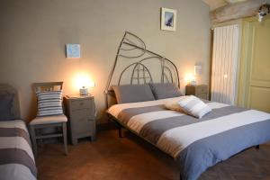 Postel nebo postele na pokoji v ubytování Agriturismo Poggio ai Legni