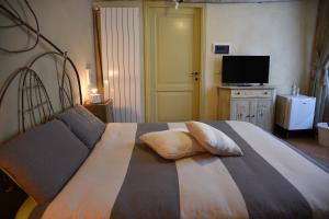 Postel nebo postele na pokoji v ubytování Agriturismo Poggio ai Legni
