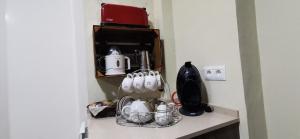 a kitchen counter with utensils on a shelf at Cal Felico 