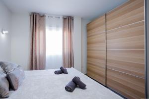 Ένα ή περισσότερα κρεβάτια σε δωμάτιο στο Palm Mar de LUX A31 +39 φωτογραφίες