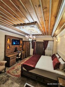 Postel nebo postele na pokoji v ubytování Cappadocia Caves Hotel
