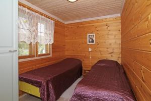 Postel nebo postele na pokoji v ubytování Marjalanranta