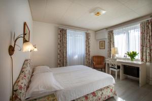 Кровать или кровати в номере Piccolo Hotel