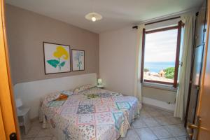 A bed or beds in a room at Appartamento Sergio