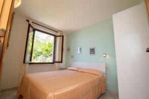 A bed or beds in a room at Appartamento Sergio