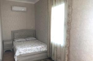 سرير أو أسرّة في غرفة في Hotel Martinichi