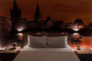 a bedroom with a bed with a view of a city at Hotel Seven Rooms in Milan