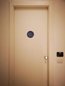 a door with a sign on it in a room at CIELO D' ALCAMO in Alcamo