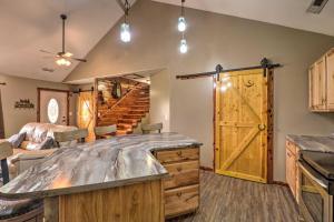 een keuken met een groot houten eiland in een kamer bij Private and Quiet Boone Terre Home with Fire Pit! in Bonne Terre