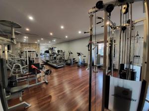 a gym with treadmills and machines in a room at Na Kamieniu Hotel & Spa in Olesno