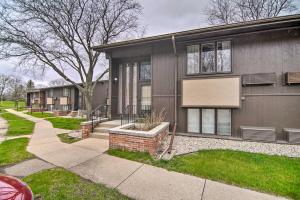 a house with a sidewalk in front of it at Cozy Lake Geneva Retreat with Year-Round Views! in Lake Geneva