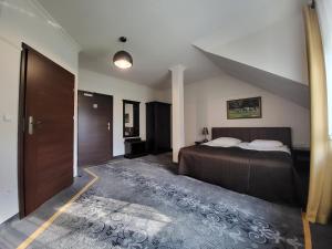 Säng eller sängar i ett rum på Na Kamieniu Hotel & Spa
