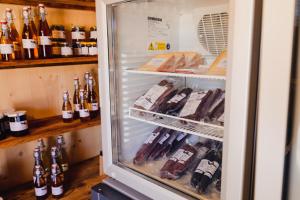 a refrigerator filled with lots of bottles of wine at Bubble-Suite mit wunderschönem Blick in Lumbrein