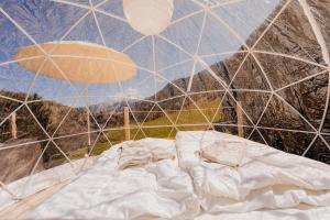 a room with a bed inside of a tent at Bubble-Suite mit wunderschönem Blick in Lumbrein