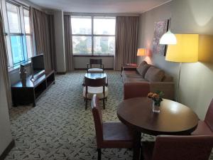 a living room with a couch and a table at Skyna Hotel Luanda in Luanda
