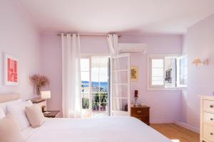 מיטה או מיטות בחדר ב-Corfu town tranquility gem