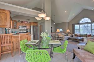 a kitchen and living room with a table and chairs at Less Than 1 Mi to Marina Family-Friendly Osage Beach Home in Osage Beach