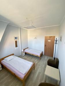 Posteľ alebo postele v izbe v ubytovaní Hostel Universus