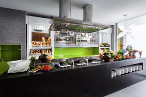 a kitchen with a counter with food on it at Barceló Teguise Beach - Adults Only in Costa Teguise