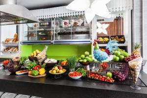 a buffet with fruits and vegetables on a counter at Barceló Teguise Beach - Adults Only in Costa Teguise