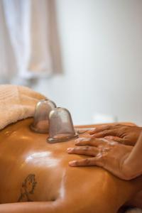 a woman getting a massage in a bath tub at Vivari Hotel and Spa by Mantis in Johannesburg