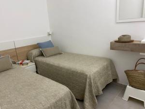 A bed or beds in a room at MY SUN LAS CANTERAS