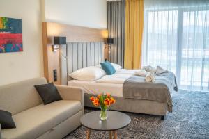 Postel nebo postele na pokoji v ubytování Lux apartmán v hoteli Akvamarín Bešenová