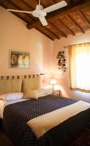 A bed or beds in a room at Agriturismo Il Quarto Még 37 kép