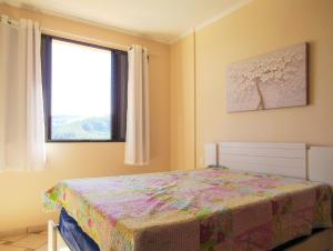 En eller flere senge i et værelse på Apto c lazer e linda vista verde Águas de Lindóia